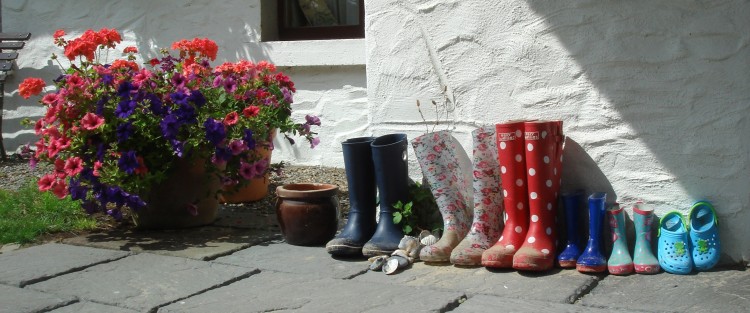 Three Generations of Wellies outside the Cottages