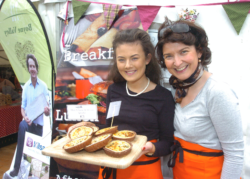 Two woman hold their food samples