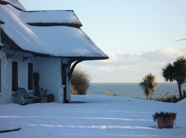 Looking out to sea, past Thatcher's Rest, covered in snow 