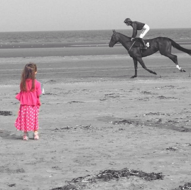A little girl enjoying Laytown Races for the first time